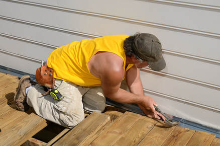 carpenter building a deck