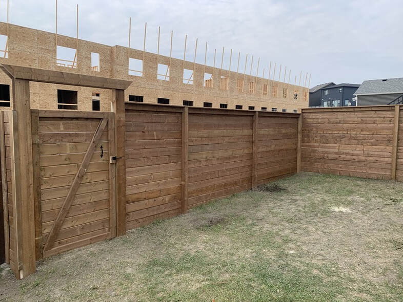 New Wooden Fence Installation in Livingston Way NW Calgary